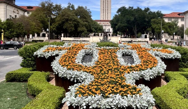 Flowers form the letters UT on the University of Texas Campus