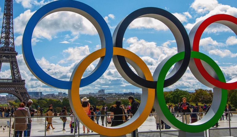 Statue of the Olympic Rings next to the Eiffel Tower in Paris