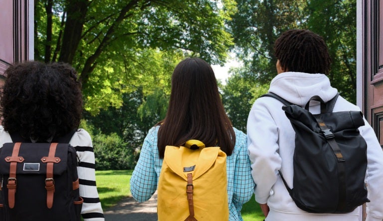 College students exit university building through open doors