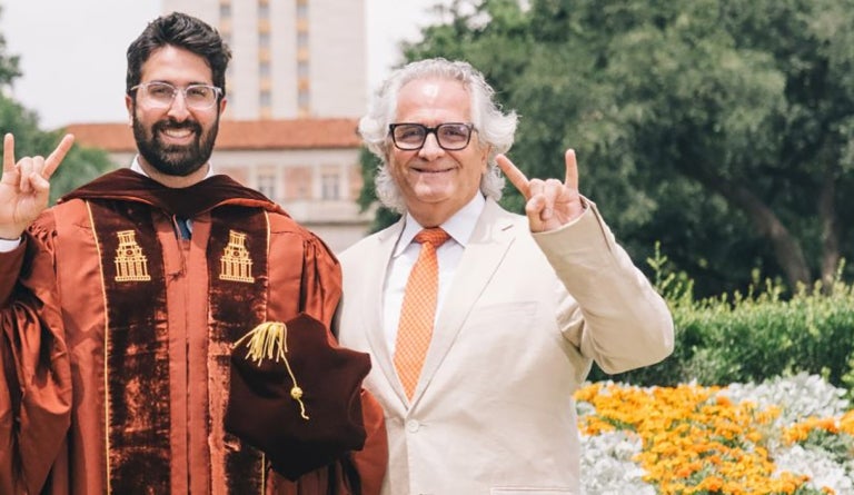 UT alumni Habib Chamoun and Antoine Chamoun Farah celebrate at the UT Tower