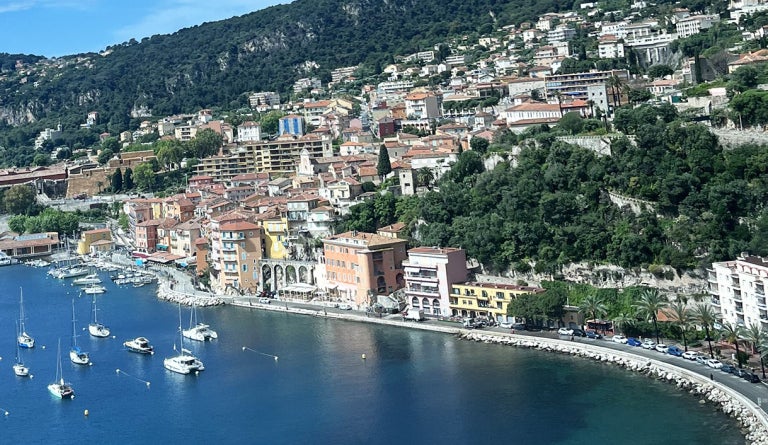 Hills rise from the ocean in the city of Nice, France