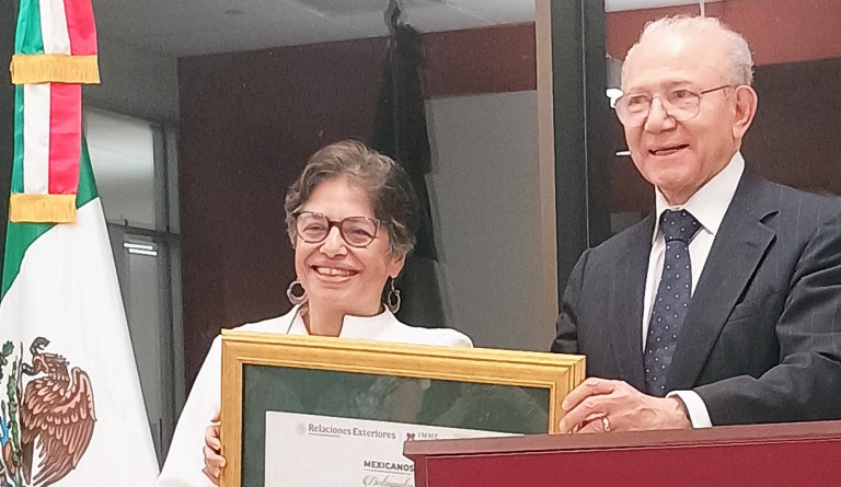 Director accepts award.