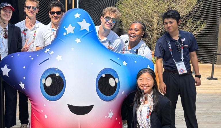 Youth Ambassadors at the Osaka World Expo 2025 pose with expo mascot