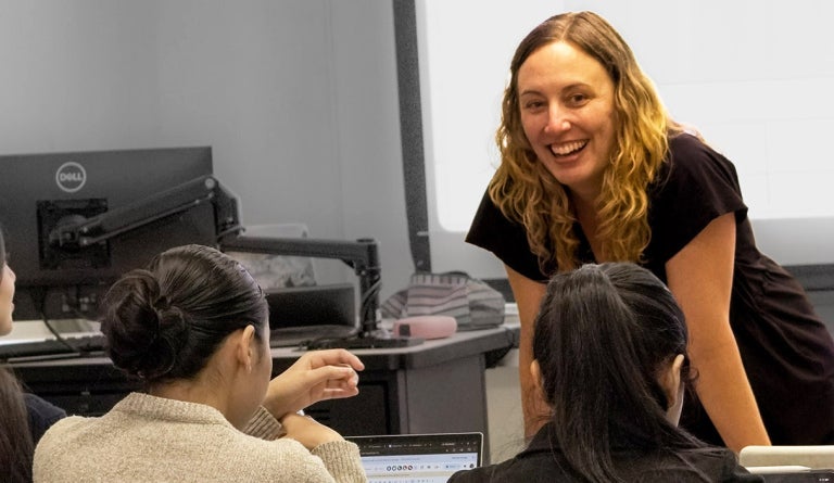 English Language Center instructor Sarah Episcopo smiles at her class