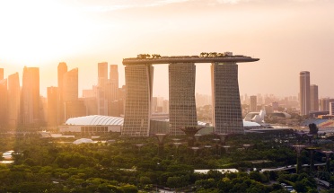 a view of the city of singapore at sunset