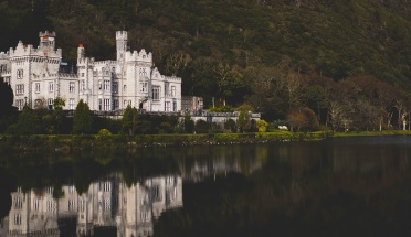 a view of a castle on a lake in ireland 