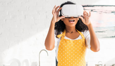 Home baker wears VR (Virtual Reality) headset in a kitchen.