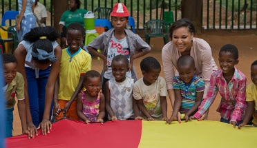 Peace Corps volunteers playing with children in Botswana