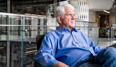 Professor Emeritus Bob Metcalfe sits in a chair and thinks