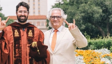 UT alumni Habib Chamoun and Antoine Chamoun Farah celebrate at the UT Tower