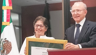 Director accepts award.