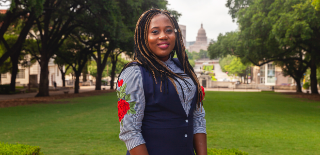 Female student Ogechukwu standing in park in Austin Texas.