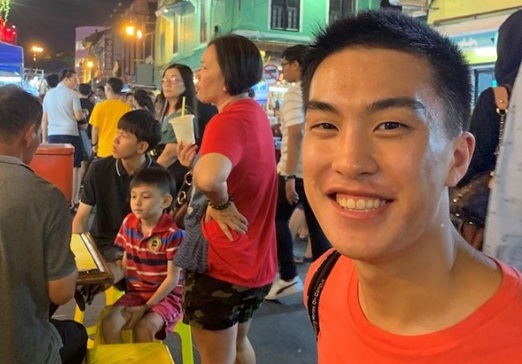 Brandon Chan smiles while studying abroad in Singapore.