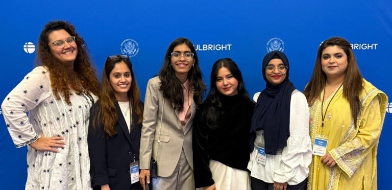Fulbright Pakistan participants smile in a group photo