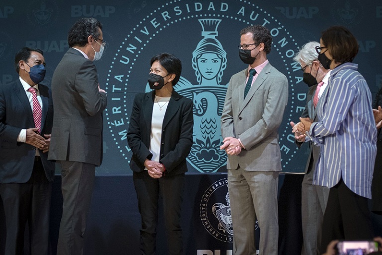 Representatives from the AMPATH Consortium and BUAP meet onstage