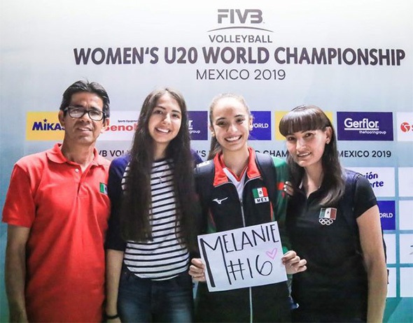 Melanie Parra poses for a photo with her family at the Women's Under-20 World Championship. 