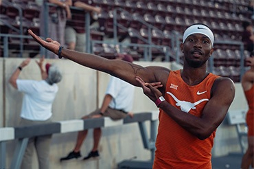 Jonathan Jones shows off a Longhorn tattoo on his right arm. 