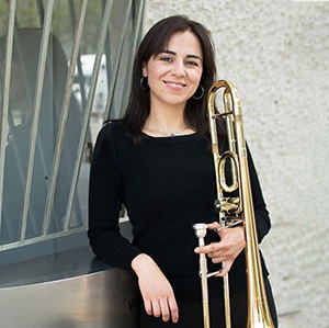 Marcia Medrano Serrano stands with her trombone