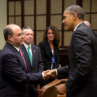 Sergio Alcocer shakes hands with U.S. President Obama
