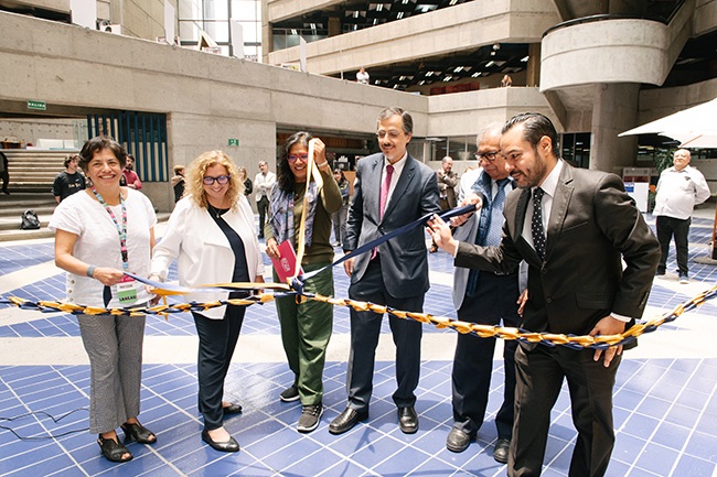 Representatives of UT's LLILAS, Texas Global and UNAM cut a ceremonial ribbon
