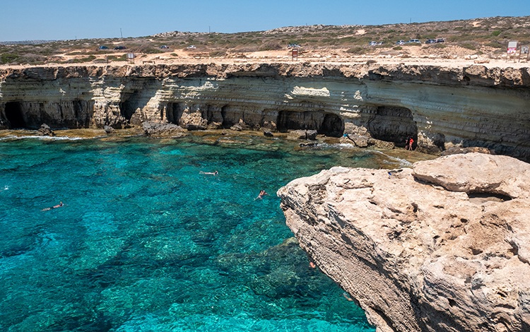 Sea caves dot the coastline on the island of Cyprus