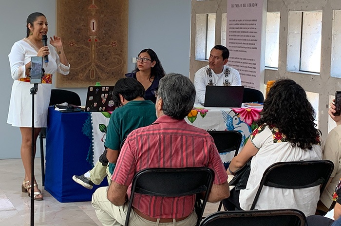 Participants listen to a speaker during the encuentro