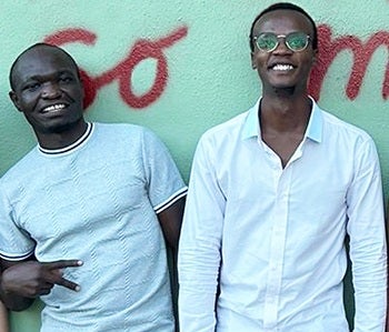 Two Kenyan medical students visiting Austin smile for the camera