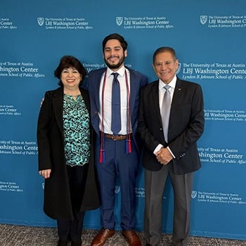 UT graduate Adolfo Cervantes smiles during LBJ Washington Center graduation