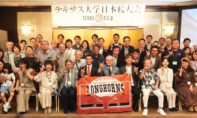 Alumni group poses for a picture.