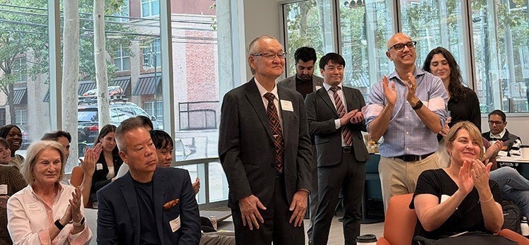 UT alum Shinichi Iimura receives applause at a Texas Global reception