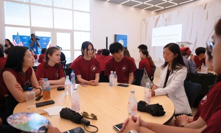 UT alum Anna Esaka interacts with guests at the Osaka World Expo 2025