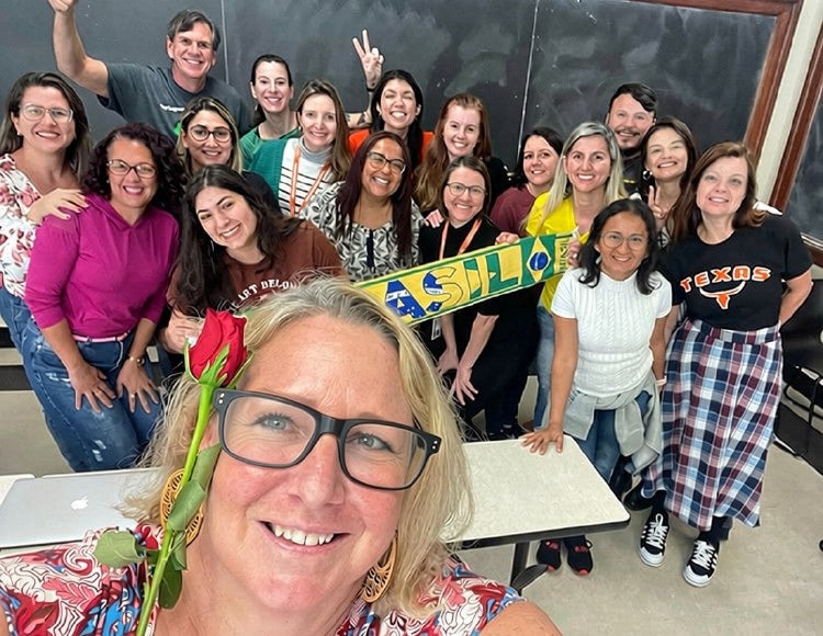 ELC instructor Meghan Ackley smiles for a self with her class