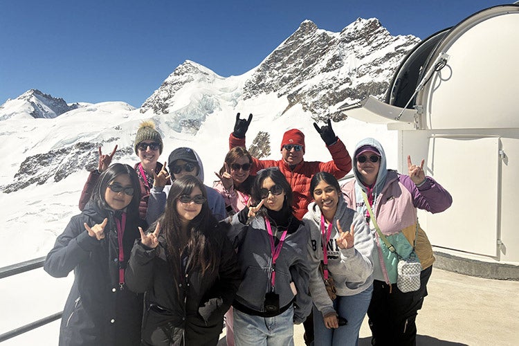 Students from UT College of Natural Sciences atop the Swiss mountain at CERN
