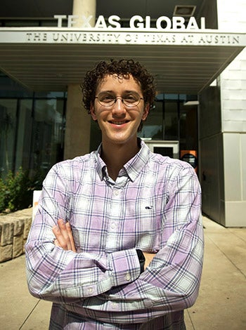 ELC cultural ambassador Julian Vaca stands in front of the Texas Global offices