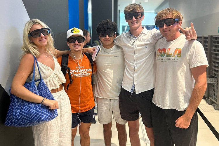 Brothers Harrison and Weston Temple smile with their mother and friends