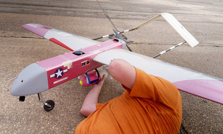 UT's FLARE-X team member works on the team's firefighting aircraft